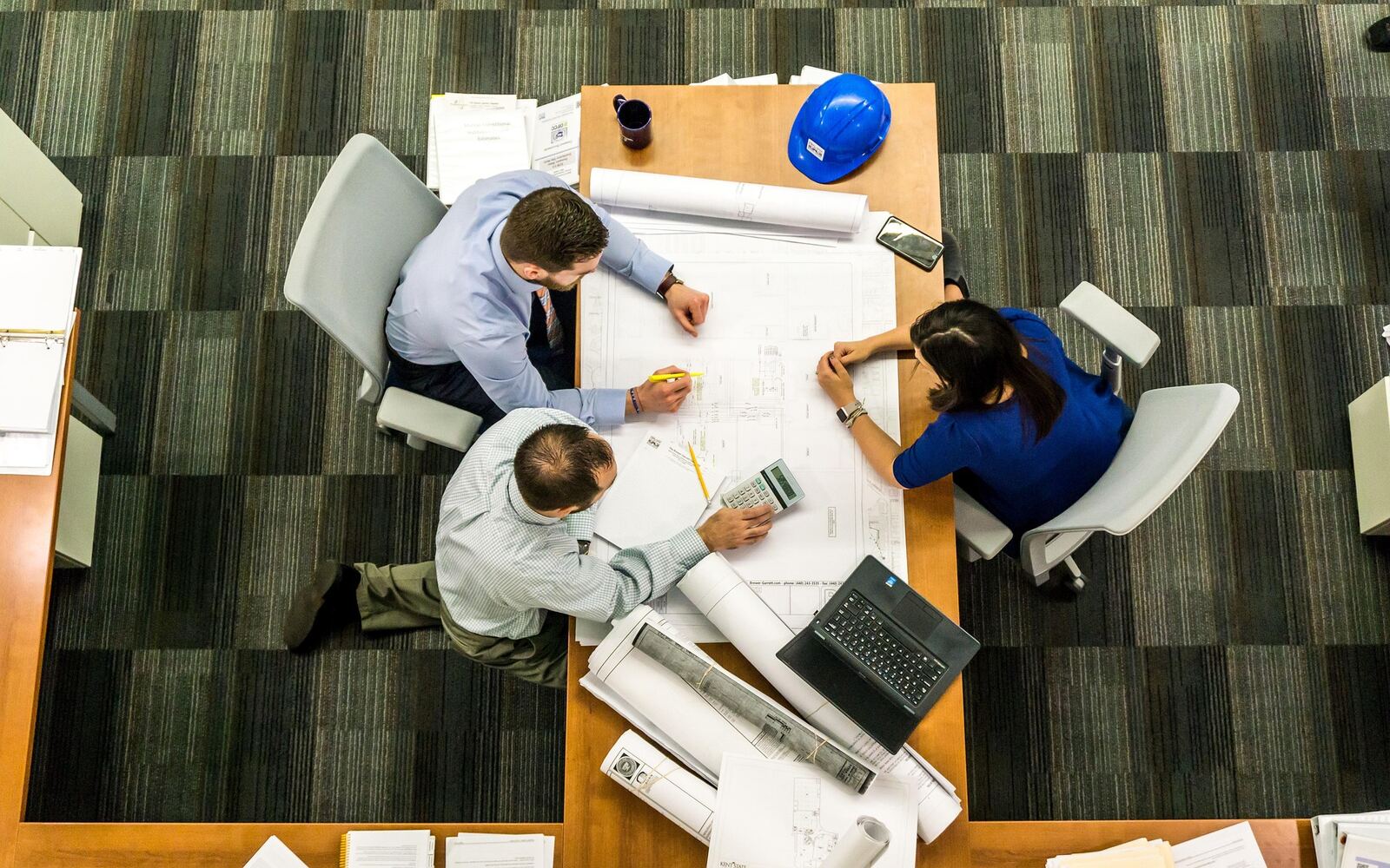 Workplace meeting representing 7 signs of burnout at work