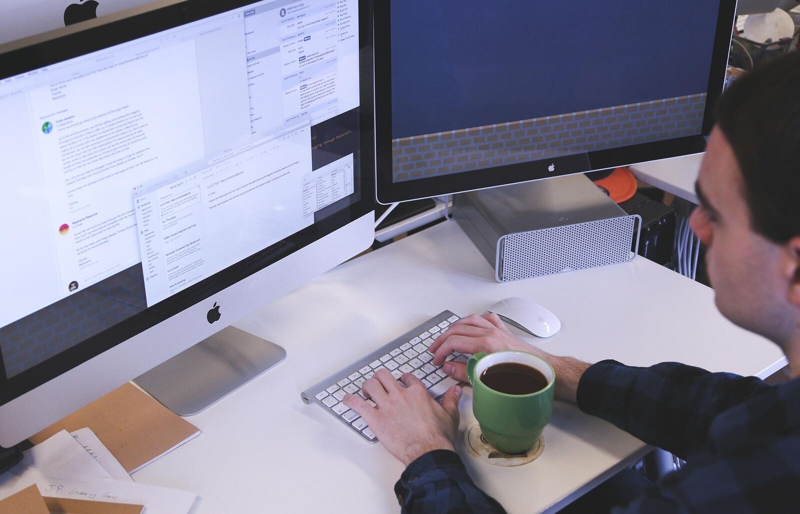 Man working at dual monitors representing how to deal with anxiety at work